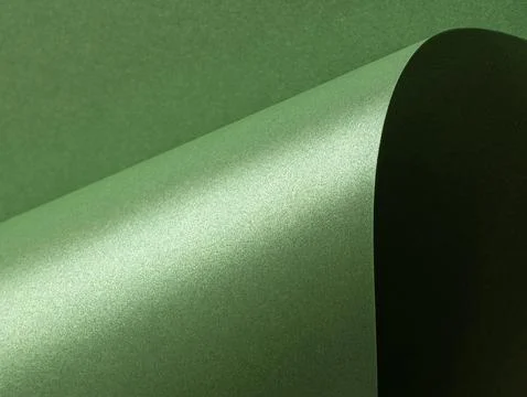 Deep forest green paper background with a smooth matte texture and subtle wav Foto stock