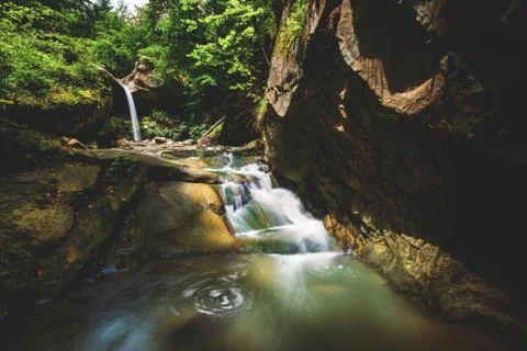 Deep forest river wild waterfall view. Stock Photos