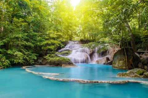 Deep forest waterfall at Erawan waterfall, beautiful waterfall with sunlight Foto stock