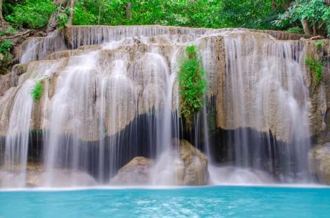 Deep forest waterfall at Erawan waterfall, beautiful waterfall with sunlight Foto stock