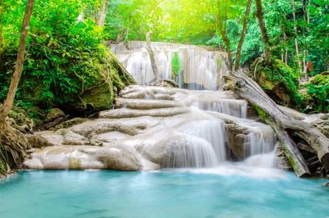 Deep forest waterfall at Erawan waterfall, beautiful waterfall with sunlight Stock Photos