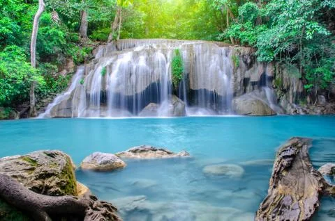 Deep forest waterfall at Erawan waterfall, beautiful waterfall with sunlight Stock Photos