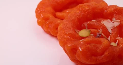 Deep fried all purpose flour batter dipped in sugar syrup sweet dessert red o Stock Footage 160885089