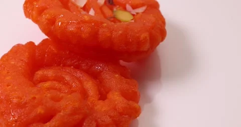 Deep fried all purpose flour batter dipped in sugar syrup sweet dessert red o Stock Footage 160886340