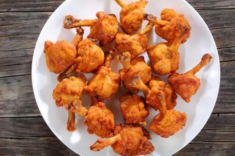 Deep fried battered crispy chicken winglets Stock Photos