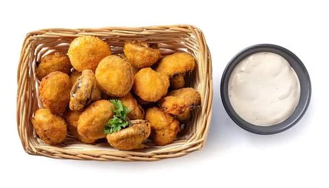 Deep fried battered mushroom caps served in a basket with side of ranch dre.. Stock Photos