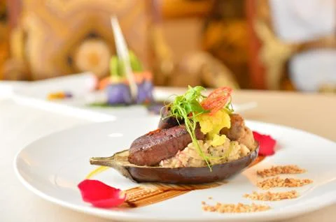 Deep fried beef with rice and salad on white plate plate in asian restaurant Stock Photos