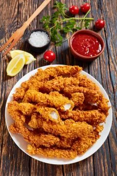 Deep fried breaded chicken breast strips Stock Photos