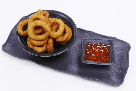 Deep fried breaded onion rings served with sweet chili sauce Stock Photos