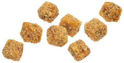 Deep fried breaded tofu cubes isolated on white background Foto stock