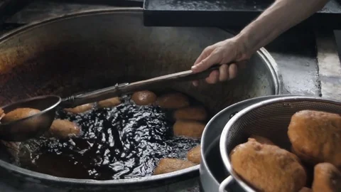 Deep fried buns in hot oil Stock Footage 74769812