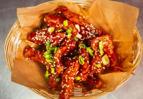 Deep fried chicken strips served on paper for take away menu in fast food res Fotos de archivo
