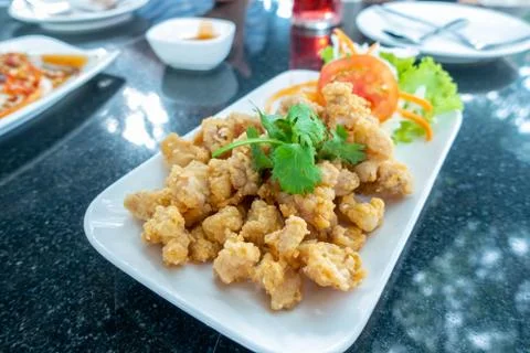 Deep fried chicken tendons on white in black stone dining table./ Blurred and Stock Photos