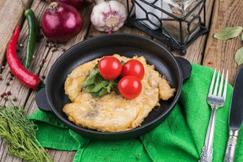 Deep-fried chop on plate with vegetable Stock Photos