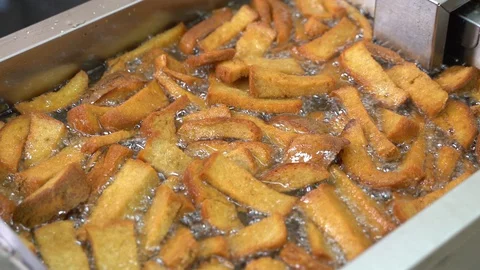 Deep-fried crackers. toasting bread in butter Stock Footage 129540162