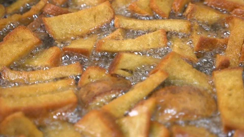 Deep-fried crackers. toasting bread in butter Stock-Footage 129542373