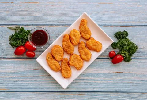 Deep Fried Crispy Chicken Nuggets with bbq dip on wood table top view Stock Photos