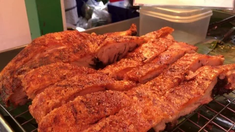 Deep fried crispy pork ribs meat on native market of Thailand 4k. Stock Footage 84347084