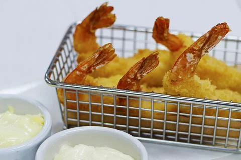 Deep fried crispy prawns accompanied with lemon and garlic mayonnaise Stock Photos