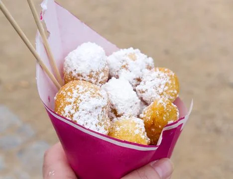 Deep-fried dough balls with powdered sugar Stock Photos