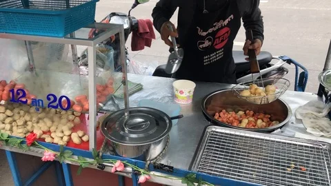 Deep fried fish ball and sausage cooking Thai street food Stock Footage 89694847