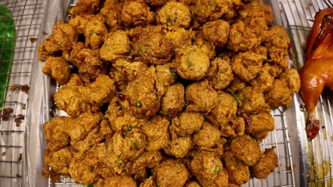Deep Fried Fish Cakes Pile on Tray Street Food Display, 4K Stock Footage 331984217