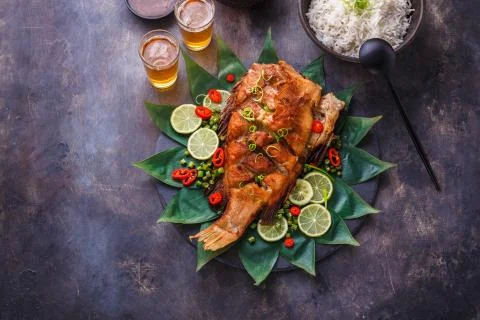Deep fried fish thai style with coconut rice, salad and spicy sauce, copy space Stock Photos