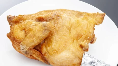 Deep fried half chicken golden crispy on white plate Stock Footage 337352358
