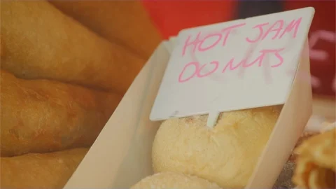 Deep fried junk food, jam donuts, unhealthy fat, amusement park carnival fair Stock Footage 106654793