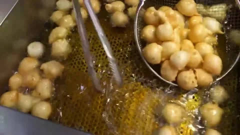 Deep Fried Korean Fish Cake Balls (Eomuk) Sizzling in Hot Oil Traditional Street Stock Footage 337374706