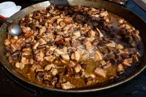 Deep fried meat being cooked at a street food festival Stock Photos
