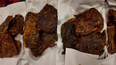 Deep Fried Meat Pieces on Paper Street Food Close-Up 4K Crispy Texture Stock Footage 331774448