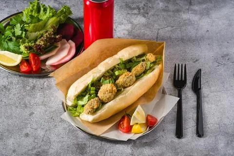 Deep fried mussels in bread and with greens on the side. Turkish name Midye.. Stock Photos
