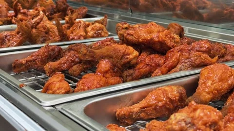 Deep Fried in Oil Chicken Pieces Piled in Metal Tray at Fast Food self service Stock Footage 345179587