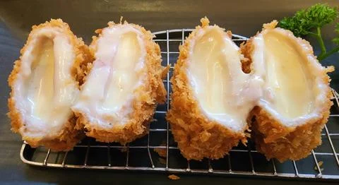 Deep Fried Pork Cutlet Stuffed with Melted Cheese Japanese Tonkatsu Style Stock Photos
