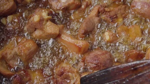 Deep fried port in a big pot Stock Footage 310017993