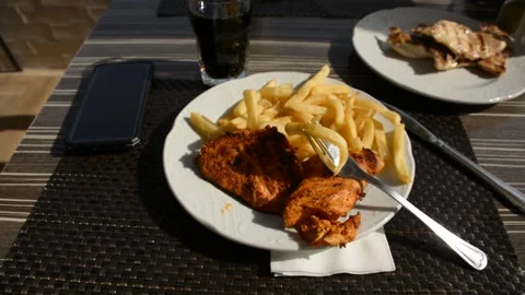 Deep fried potato with chicken nuggets low hard light Stock Footage 163079679