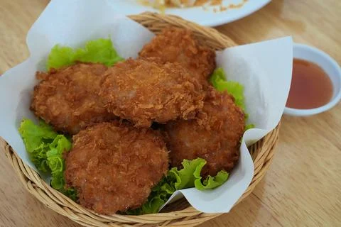 Deep fried shrimp cake, one of well known Thai style appetizer, on wooden tab Stock Photos