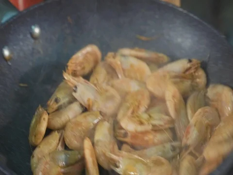 Deep fried shrimps preparing frying pan close-up slow motion. Stock Footage 82840079