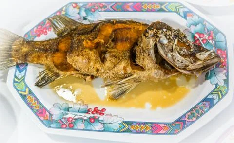 Deep fried snapper with sweet fish sauce, Thai style dish Stock Photos