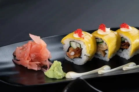 Deep-fried soft-shell crab, cucumber, mango, mayonnaise and tobiko isolated o Stock Photos