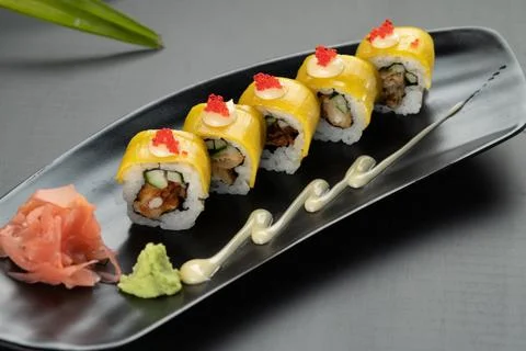 Deep-fried soft-shell crab, cucumber, mango, mayonnaise and tobiko isolated o Stock Photos