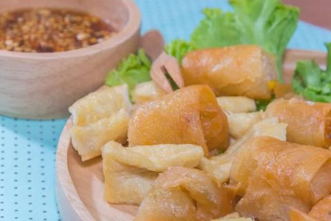Deep fried spring roll and Fried Tofu with sauce Stock Photos