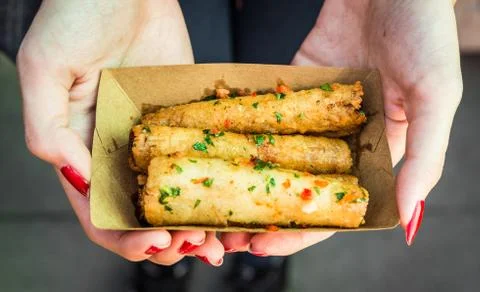 Deep fried spring rolls, Chinese cuisine staple, at a street food market. Stock Photos