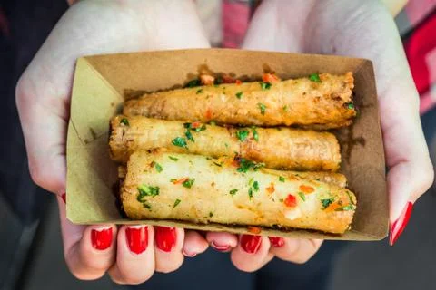 Deep fried spring rolls, Chinese cuisine staple, at a street food market. Stock Photos