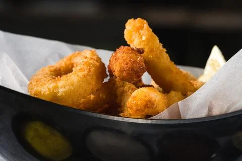 Deep fried squid, shrimp and mussels with sauces on the side Stock Photos