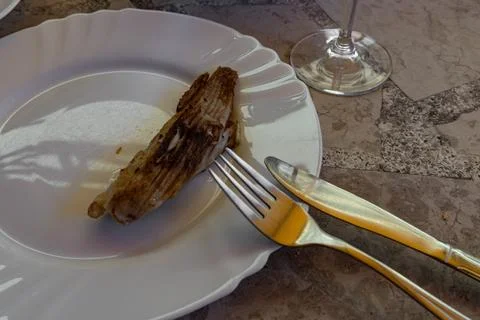 Deep-fried stingray, also known as thornback stingray, cut into pieces, arr.. Stock Photos
