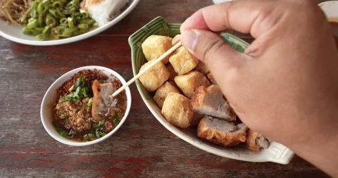 Deep fried tofu and fried taro, served with sweet chili sauce. Stock Footage 278320201