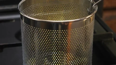 Deep fryer ladle with grid on burning stove. Medium shot. 库存影片 306990535