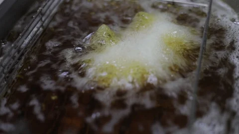 Deep Frying Breaded Brie Cheese Stock Footage 129339884